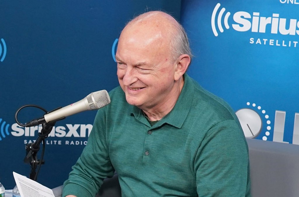 Dave Marsh laughing at the microphone in the SiriusXM studio, 2018