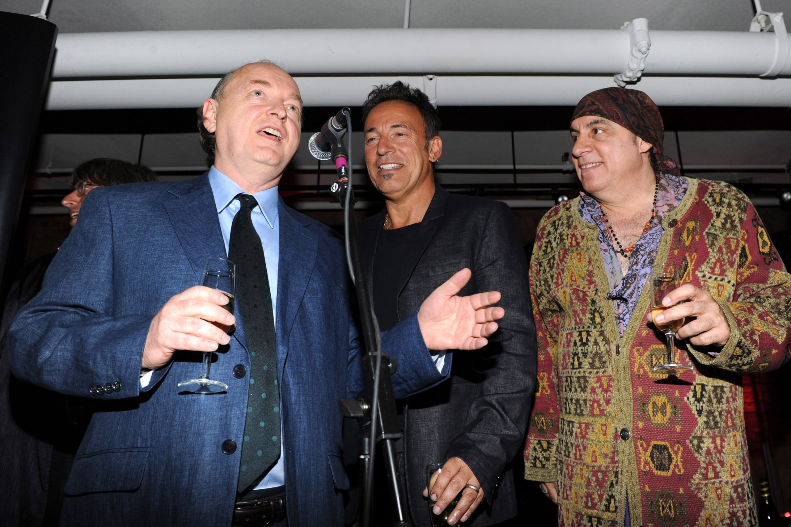Dave Marsh raising a glass alongside Bruce Springsteen and Steven Van Zandt, 2010