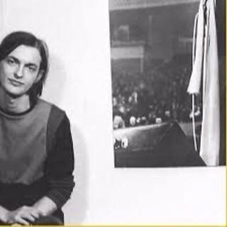 Dave Marsh as a young man beside a photograph of a concert crowd